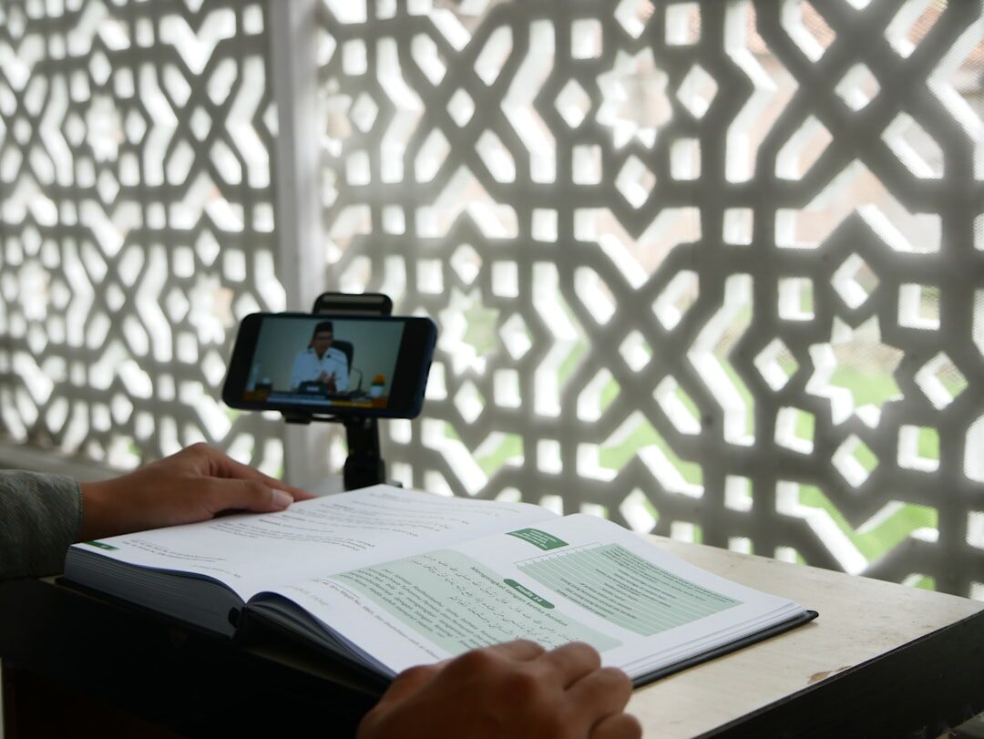 Person rehearsing a speech in front of a laptop camera